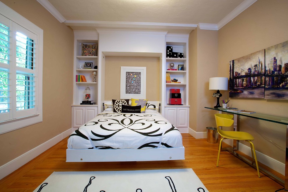 Photo of an eclectic bedroom in Sacramento with beige walls, medium hardwood flooring and no fireplace.