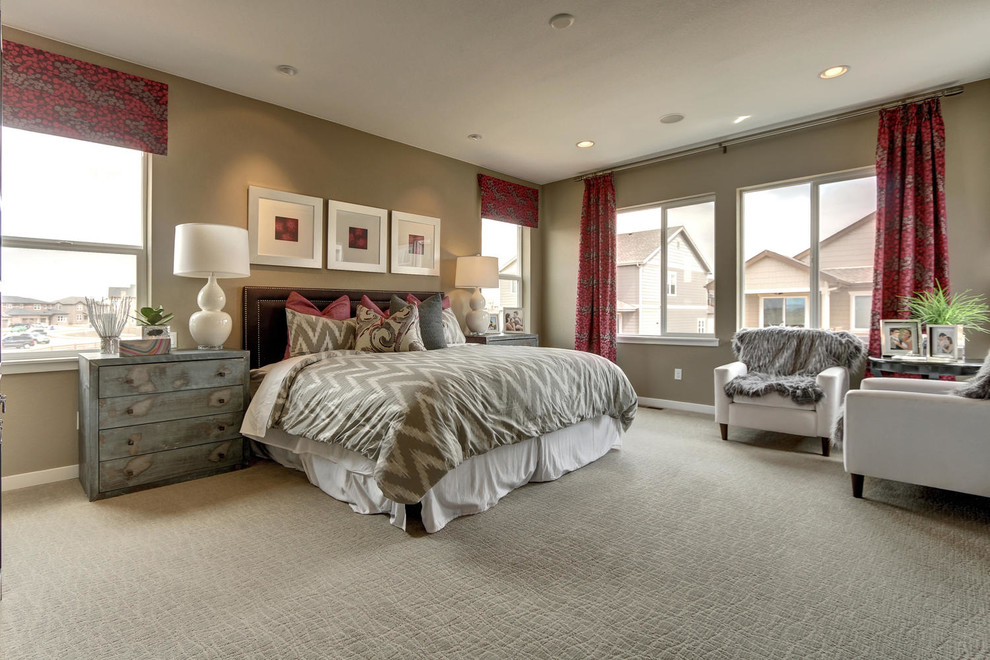 Inspiration for a large transitional master carpeted bedroom remodel in Denver with beige walls and no fireplace
