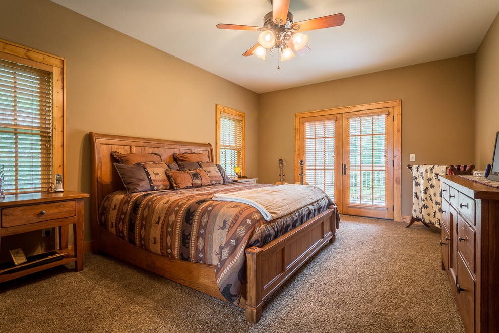 Bedroom - mid-sized rustic master carpeted bedroom idea in Charlotte with beige walls and no fireplace