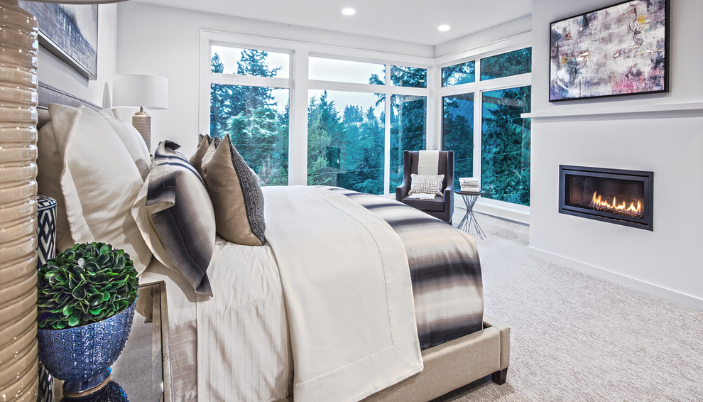 Inspiration for a large traditional master bedroom in Seattle with white walls, carpet, a standard fireplace and grey floors.