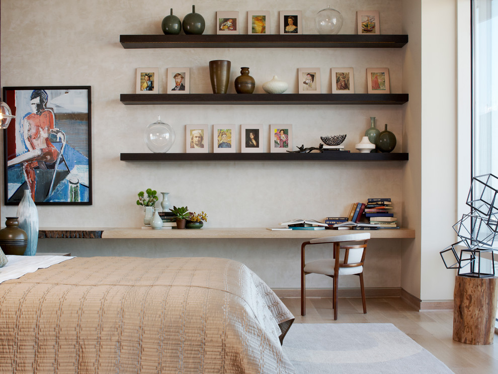 Bedroom - modern medium tone wood floor bedroom idea in New York with beige walls