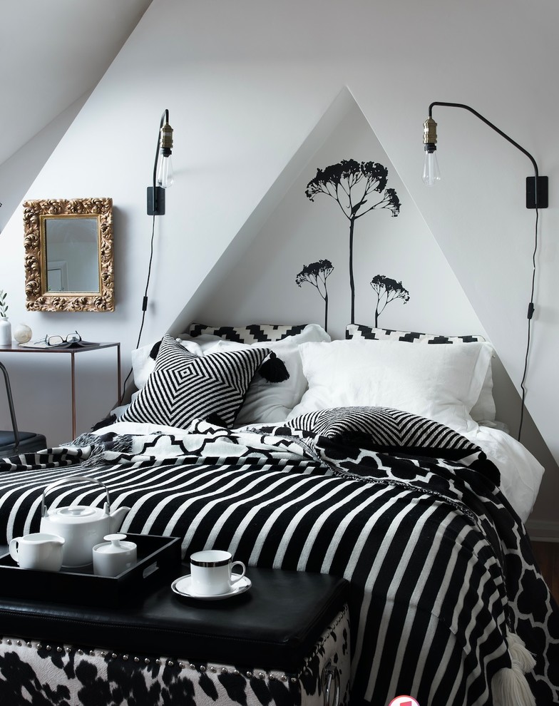 Design ideas for a traditional bedroom in London with white walls.