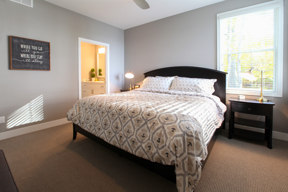 Small beach style master carpeted bedroom photo in Grand Rapids with gray walls