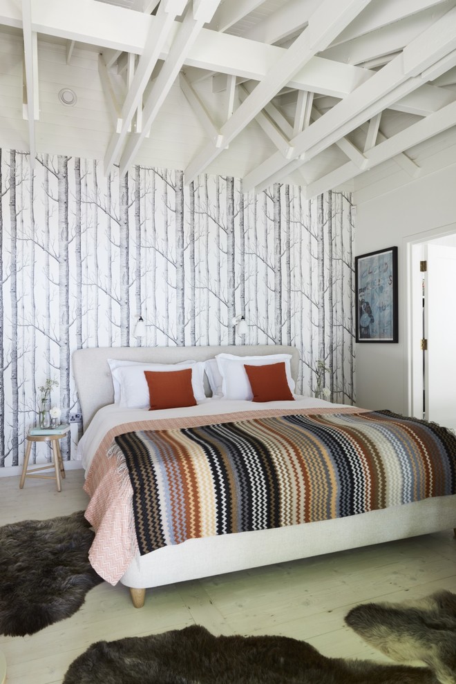 Example of a mid-sized mountain style master light wood floor bedroom design in Other with multicolored walls