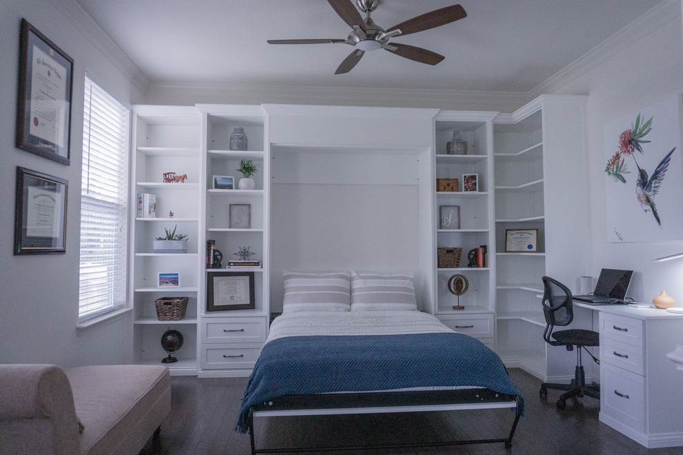 Trendy guest dark wood floor and brown floor bedroom photo in Los Angeles with white walls