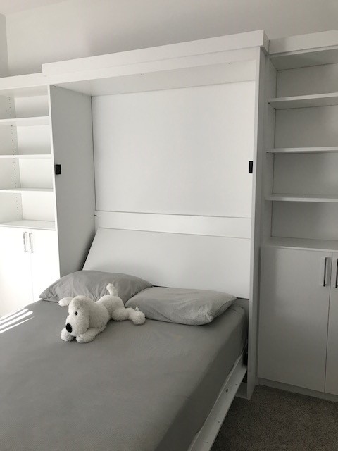 Medium sized traditional guest bedroom in DC Metro with white walls.