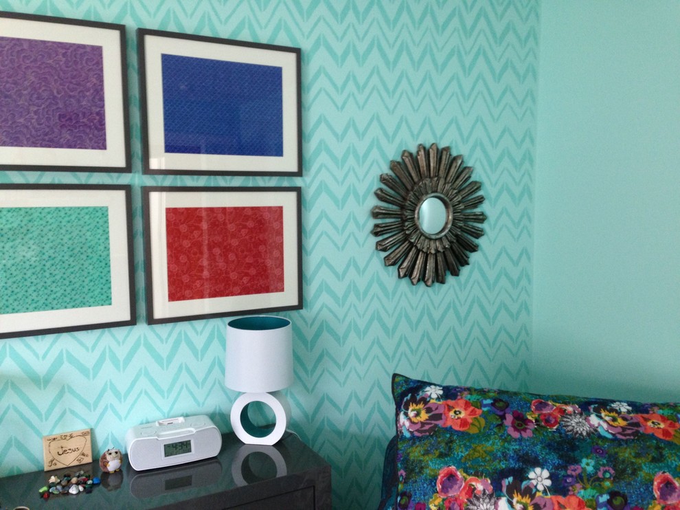 Eclectic bedroom photo in Grand Rapids with blue walls