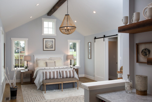 Bedroom with bed, dresser, and window. White ceiling paint color adds brightness to the room.