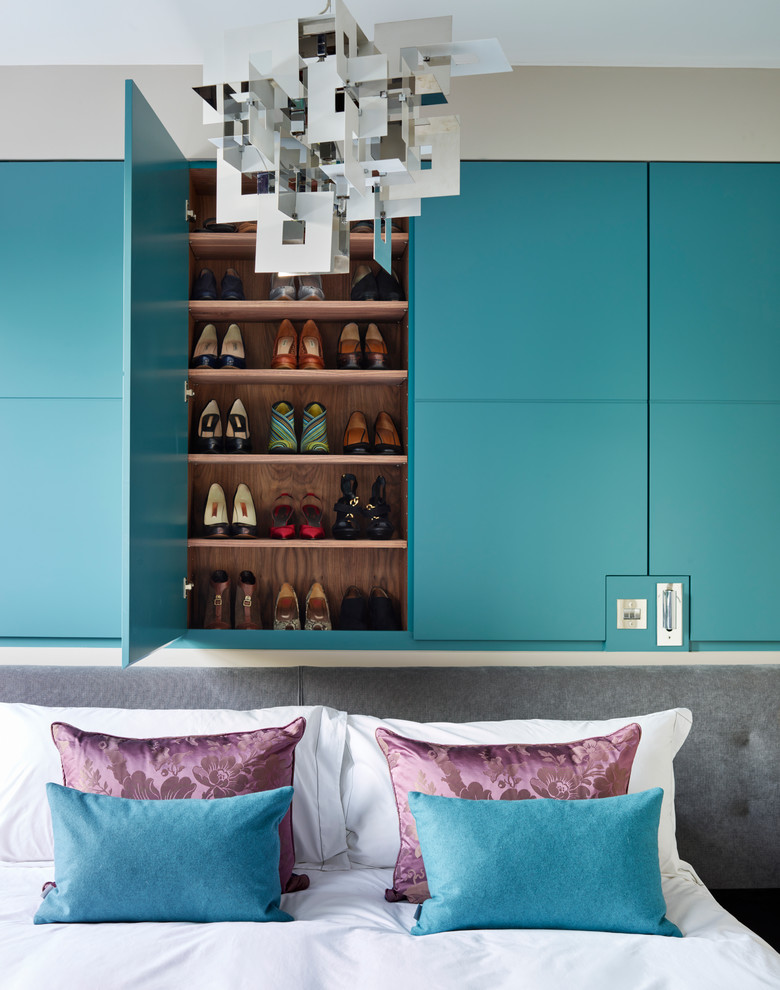 Example of a trendy master carpeted bedroom design in London with no fireplace