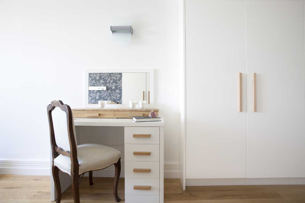 Example of a trendy bedroom design in London with white walls