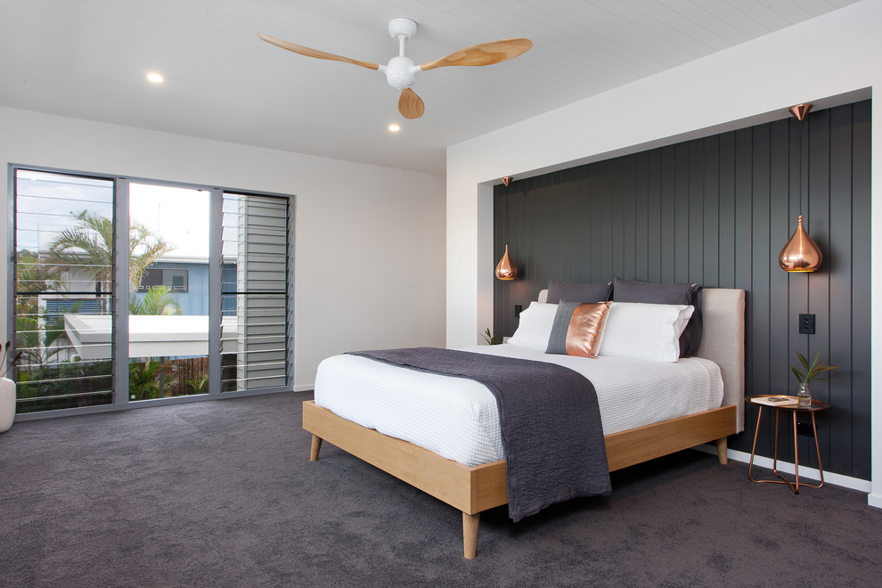 Стильный дизайн: спальня в современном стиле с черными стенами и ковровым покрытием - последний тренд