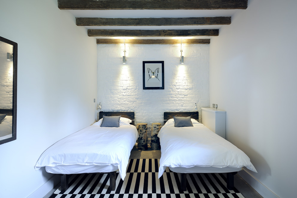 Bedroom - farmhouse guest carpeted bedroom idea in Hampshire with white walls