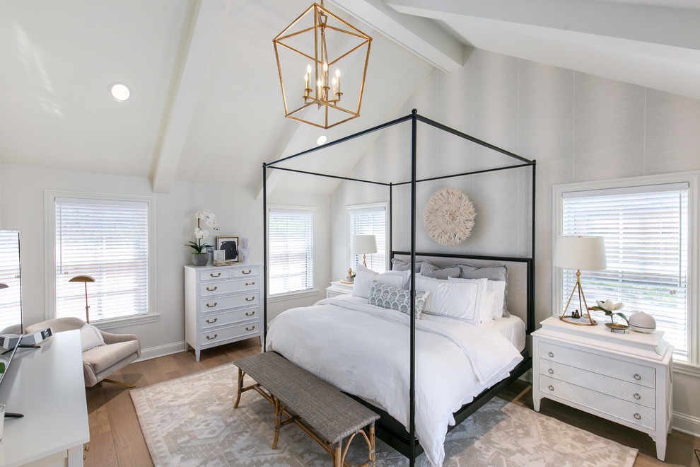 Bedroom - mid-sized transitional master medium tone wood floor and brown floor bedroom idea in Kansas City with white walls