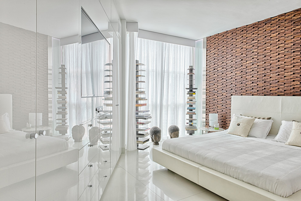 Example of a mid-sized trendy master concrete floor bedroom design in Miami with white walls