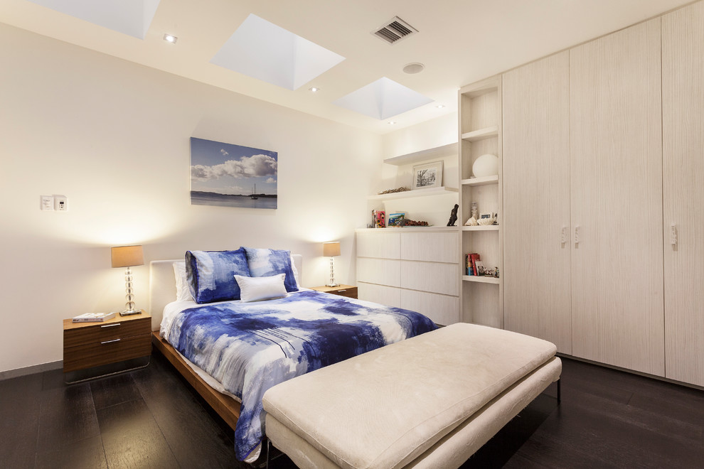 Bedroom - contemporary dark wood floor and brown floor bedroom idea in Melbourne with white walls