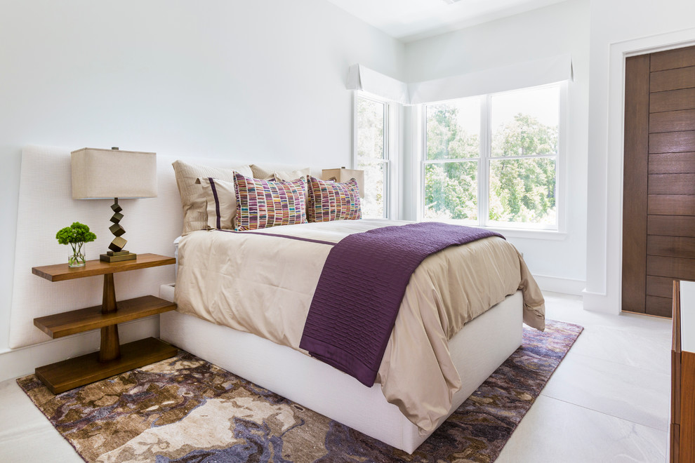 Inspiration for a contemporary guest bedroom in Houston with white walls and porcelain flooring.