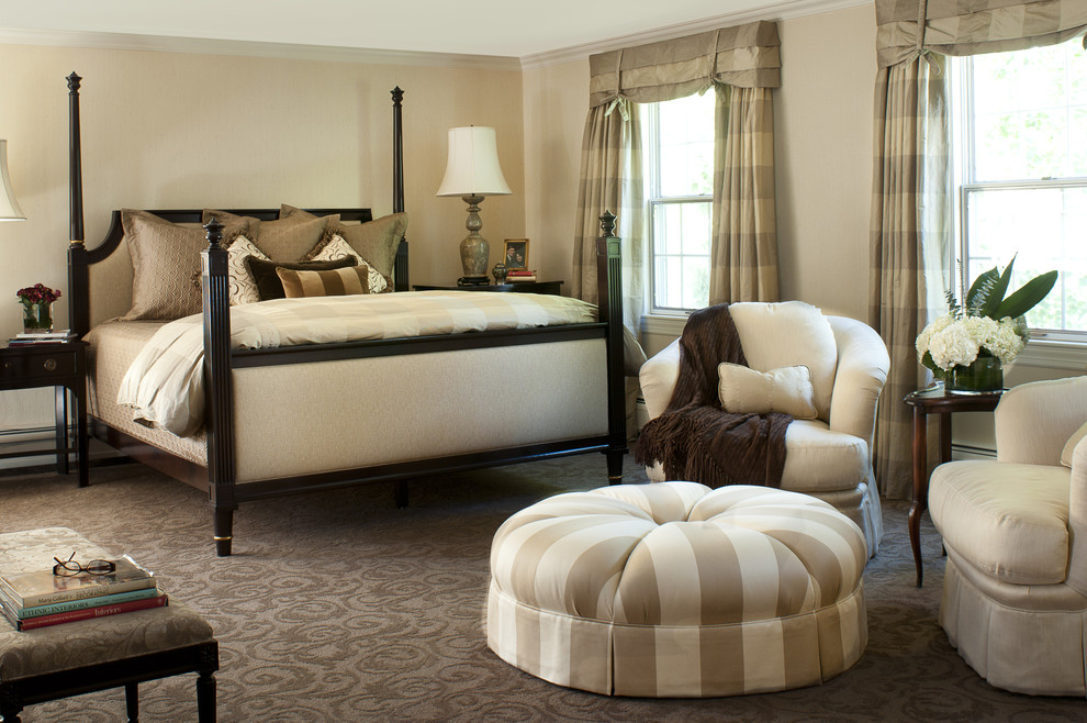 Inspiration for a classic master bedroom in Boston with beige walls and carpet.