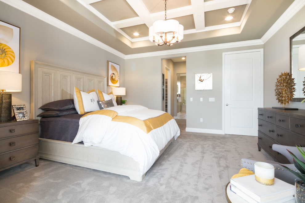 Design ideas for a traditional master bedroom in Orange County with carpet.