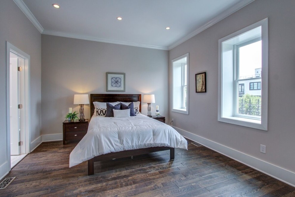 Mid-sized trendy guest porcelain tile and brown floor bedroom photo in DC Metro with white walls and no fireplace