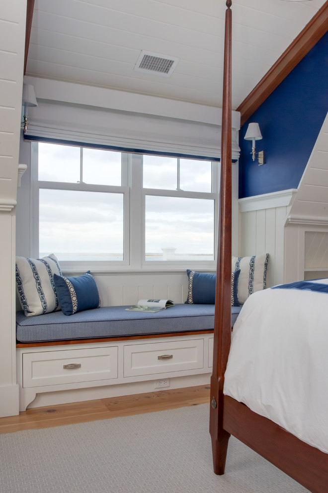 Bedroom - large coastal guest light wood floor and beige floor bedroom idea in Boston with blue walls and no fireplace