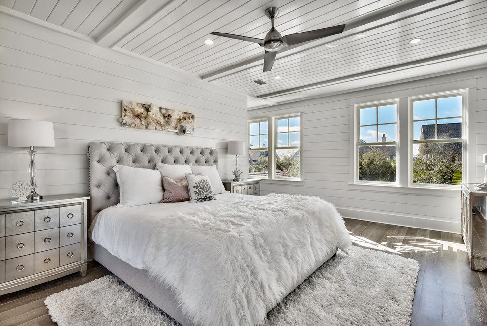 Inspiration for a mid-sized coastal master dark wood floor and brown floor bedroom remodel in Miami with white walls and no fireplace