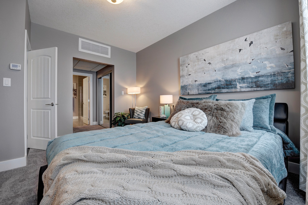 Example of a transitional bedroom design in Edmonton