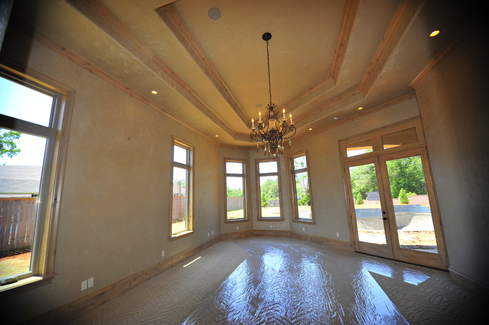 This is an example of an expansive mediterranean master bedroom in Dallas with carpet.