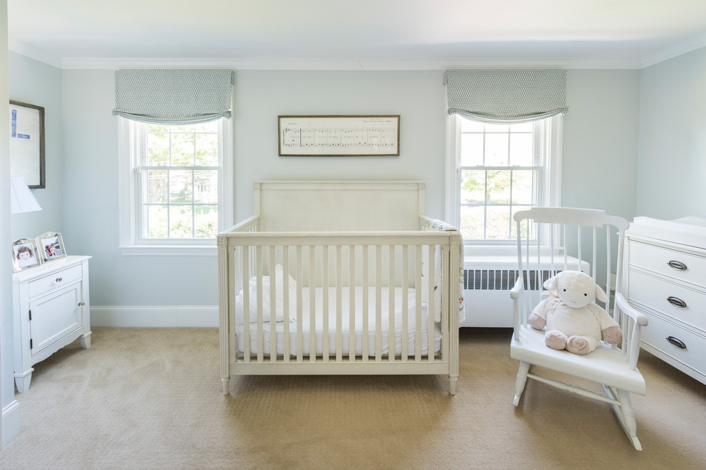 Inspiration for a mid-sized transitional carpeted and beige floor nursery remodel in Philadelphia with blue walls