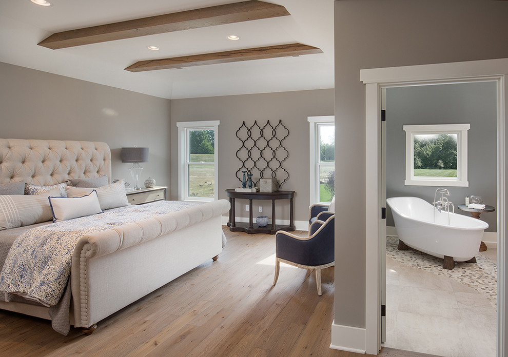 Bedroom - large country master medium tone wood floor bedroom idea in Columbus with gray walls and no fireplace