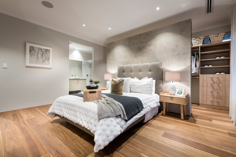 Contemporary bedroom in Perth with a feature wall.