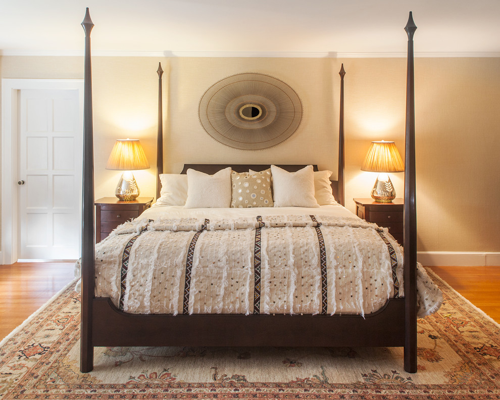 Elegant bedroom photo in New York with beige walls