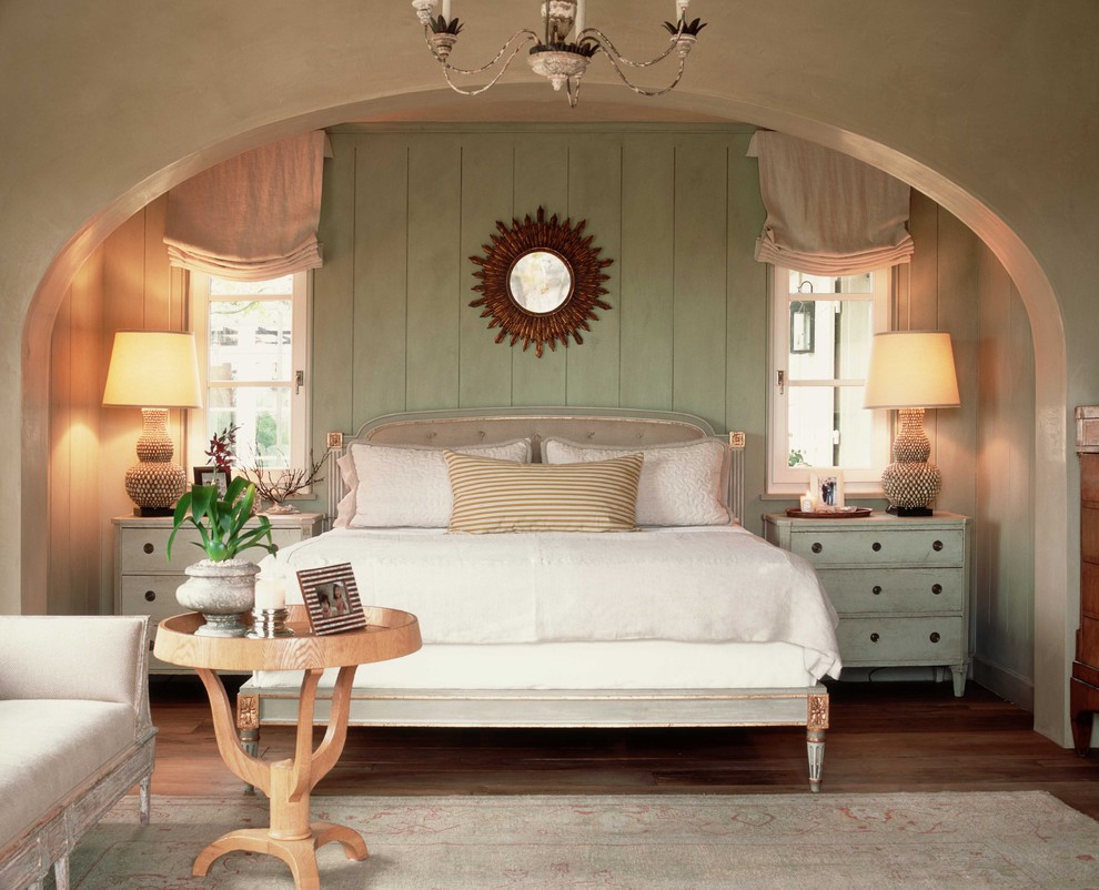 Shabby-chic style bedroom in Orange County with green walls.