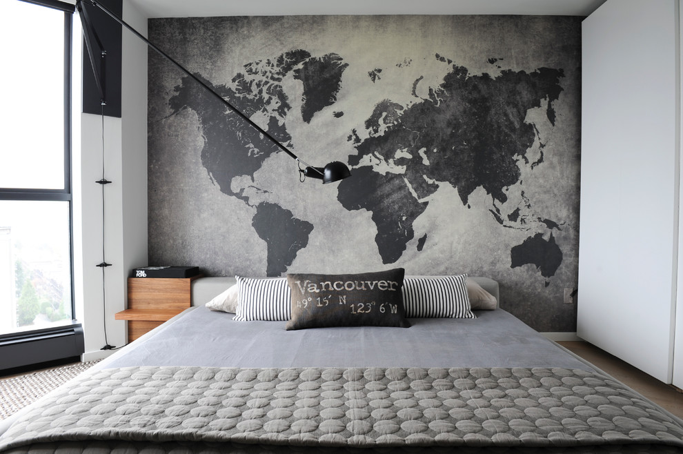 Example of a small trendy master light wood floor bedroom design in Vancouver with gray walls and no fireplace