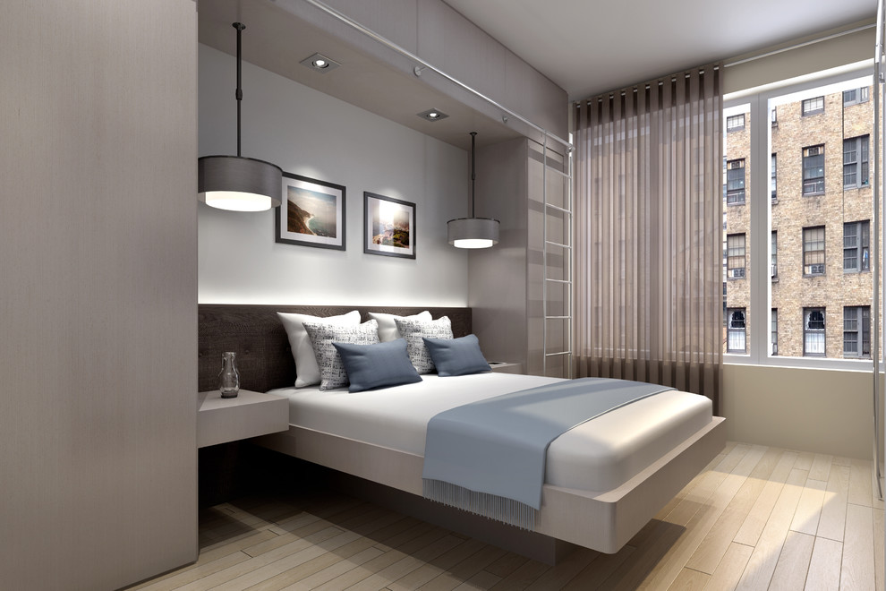 Mittelgroßes Modernes Hauptschlafzimmer mit weißer Wandfarbe und hellem Holzboden in New York