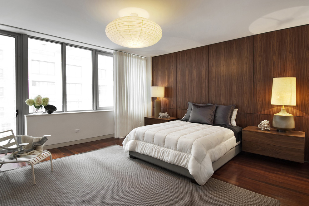 Design ideas for a contemporary master bedroom in New York with white walls, dark hardwood flooring and no fireplace.