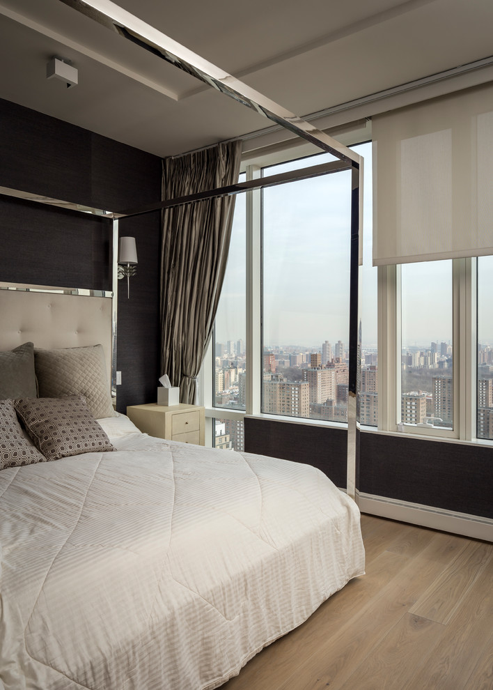 Inspiration for a traditional bedroom in New York with grey walls, light hardwood flooring and beige floors.