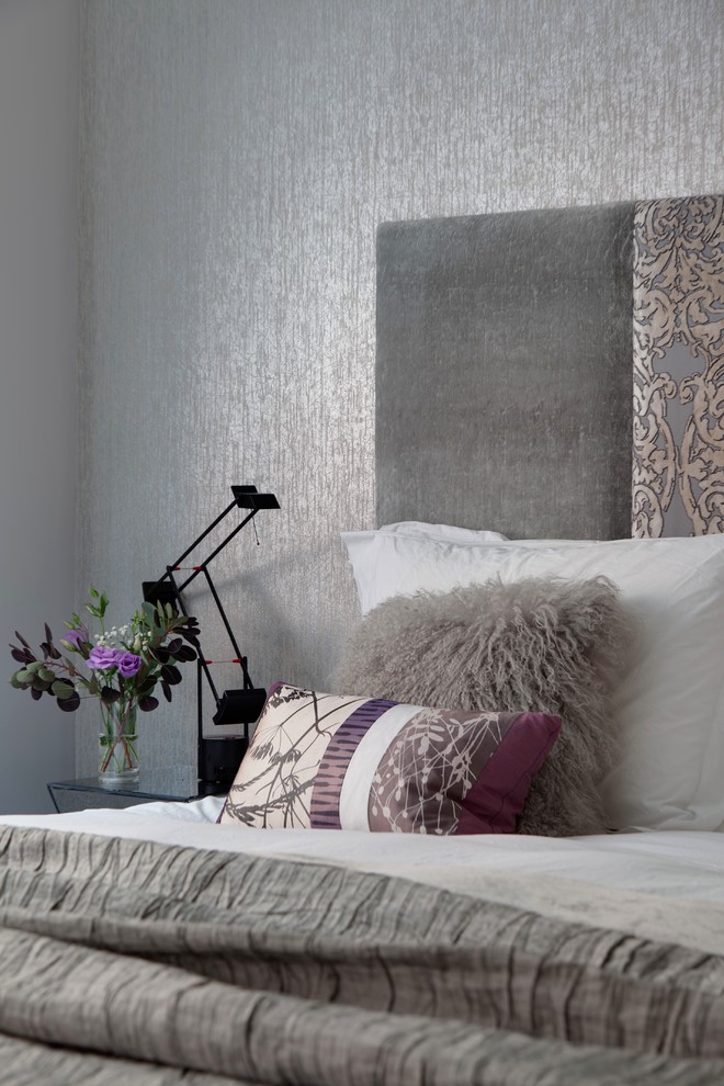 Small trendy master dark wood floor bedroom photo in London with gray walls