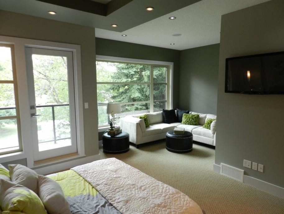 Inspiration for a mid-sized contemporary master carpeted bedroom remodel in Calgary with gray walls