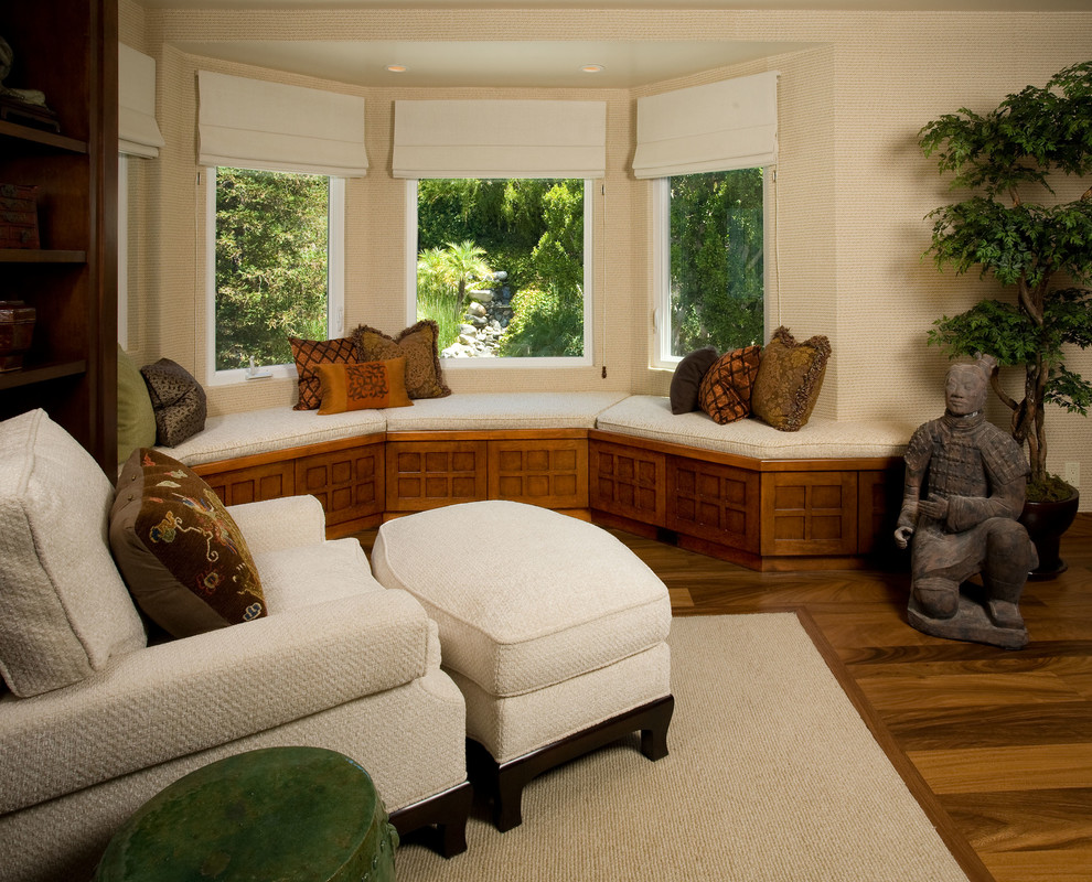 Example of an asian master dark wood floor bedroom design in Los Angeles with beige walls