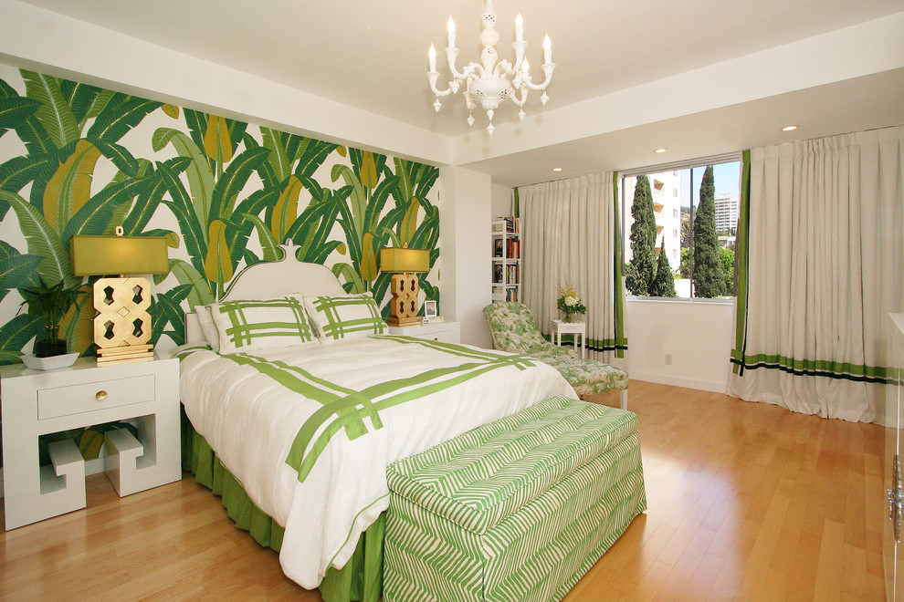 Trendy medium tone wood floor bedroom photo in Los Angeles with green walls