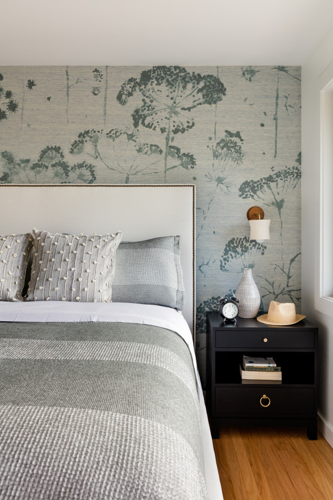 Example of a trendy master bedroom design in Seattle with blue walls