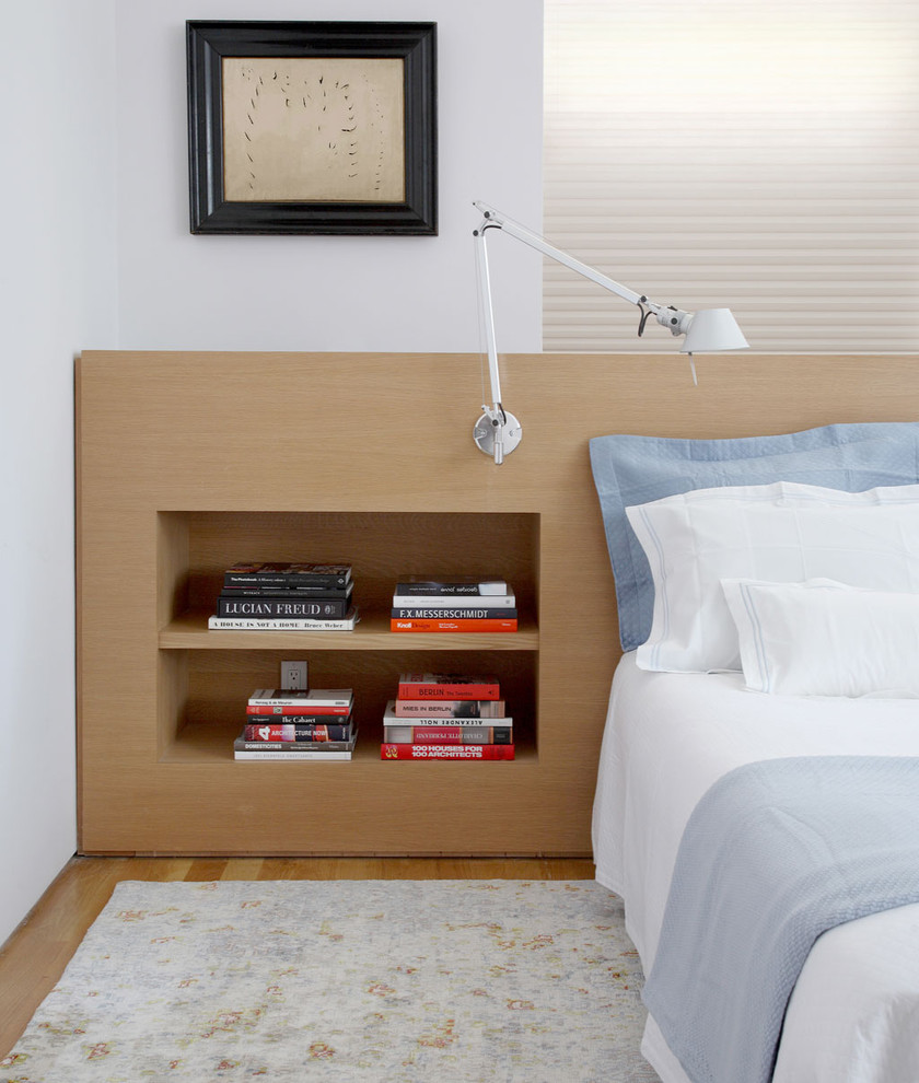 Bedroom - contemporary bedroom idea in New York with white walls