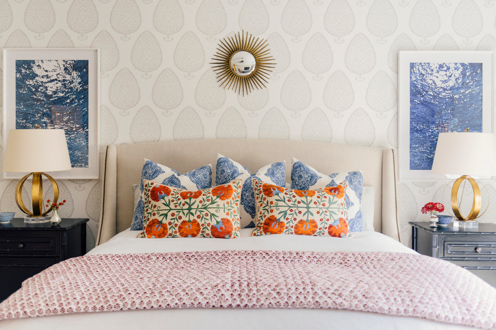 This is an example of a traditional master bedroom in Houston with beige walls.