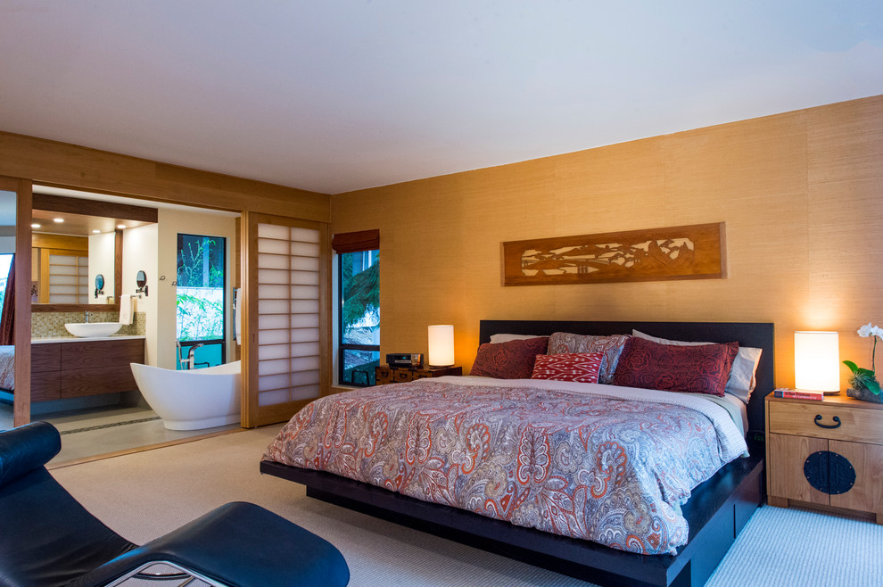 Example of a large asian master carpeted and beige floor bedroom design in Vancouver with beige walls and no fireplace