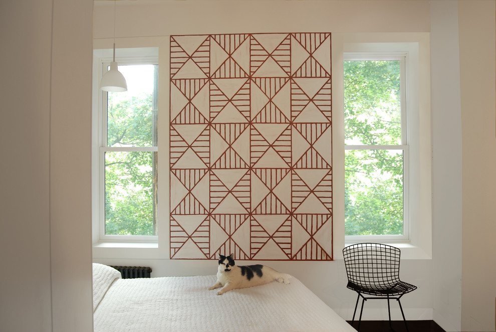 Inspiration for a contemporary bedroom remodel in New York with white walls