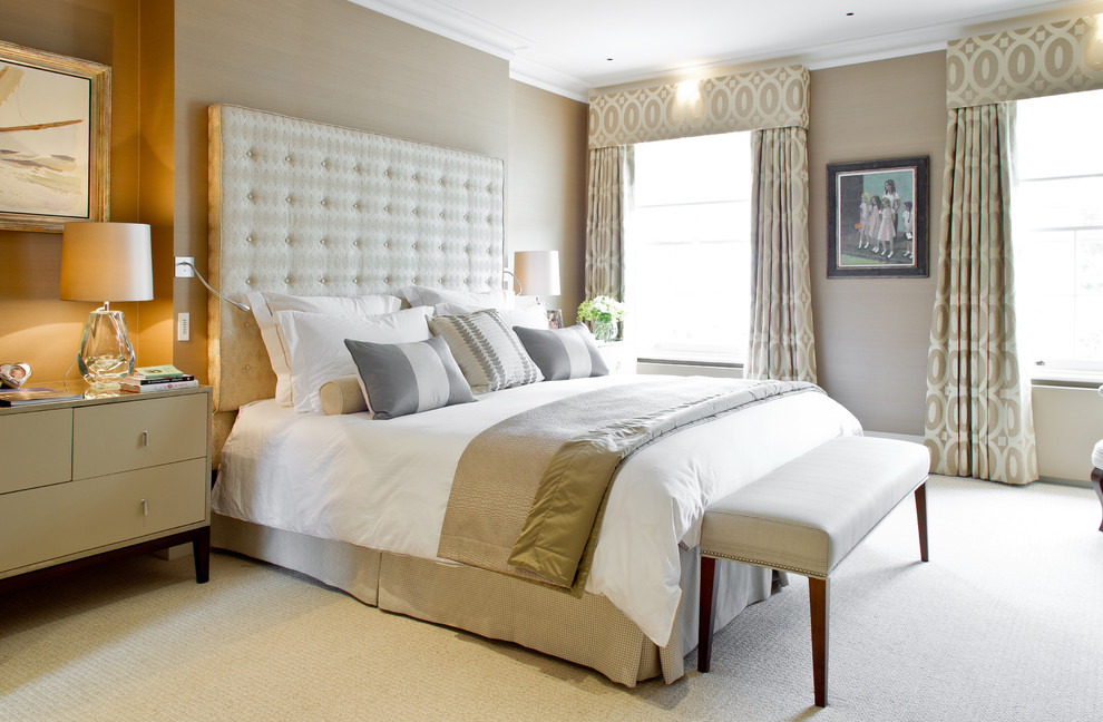 Design ideas for a medium sized classic master bedroom in London with beige walls and carpet.