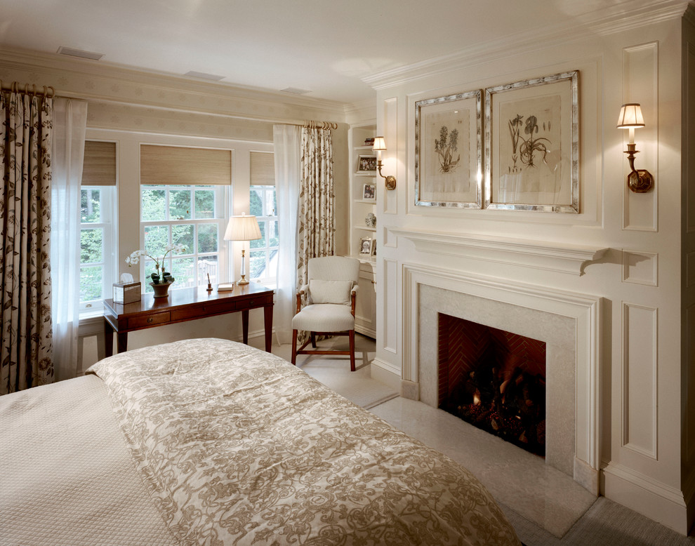 Foto de dormitorio principal tradicional con paredes blancas, moqueta, todas las chimeneas y marco de chimenea de piedra