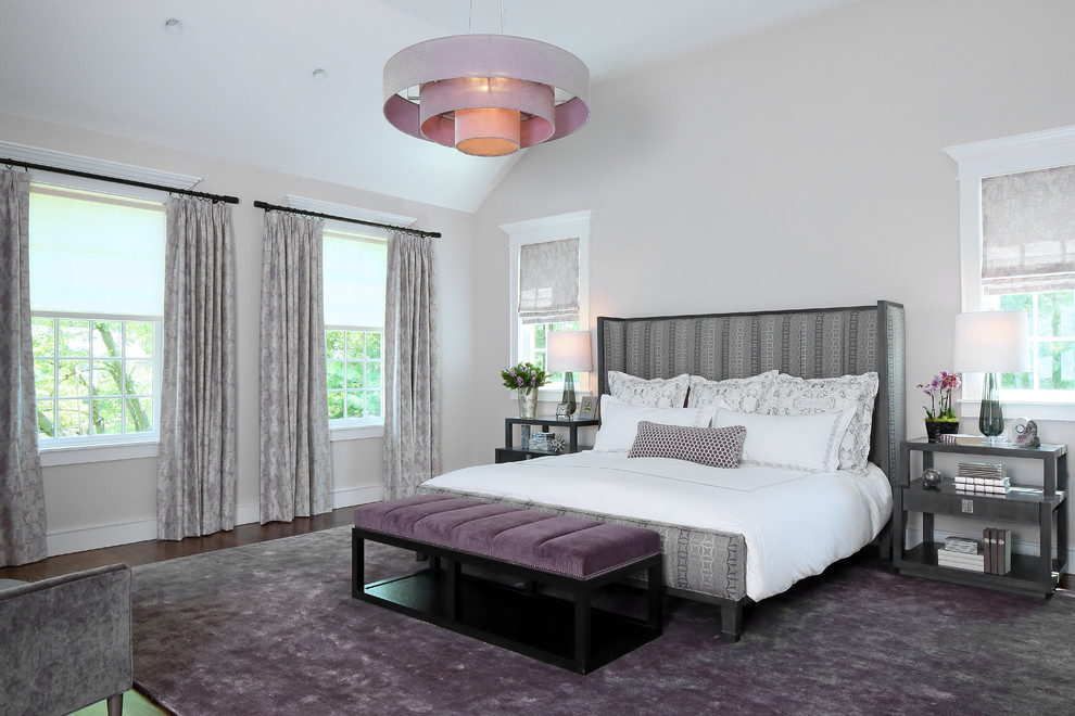 Design ideas for a traditional grey and purple bedroom in New York with grey walls, dark hardwood flooring and brown floors.