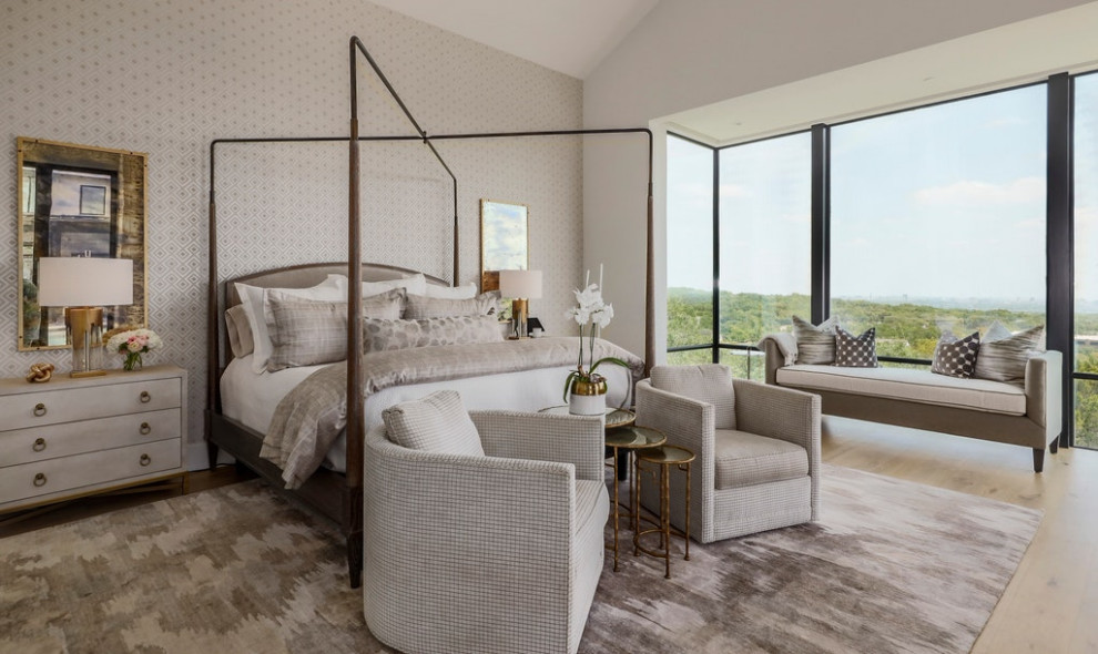 Inspiration for a transitional master light wood floor, vaulted ceiling and wallpaper bedroom remodel in Austin with gray walls