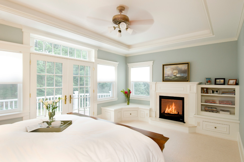 Medium sized traditional master bedroom in Boston with grey walls, carpet, a standard fireplace and white floors.